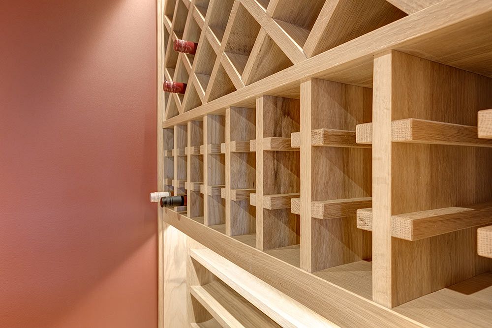 Wine room built in under the stairs, full use of space.